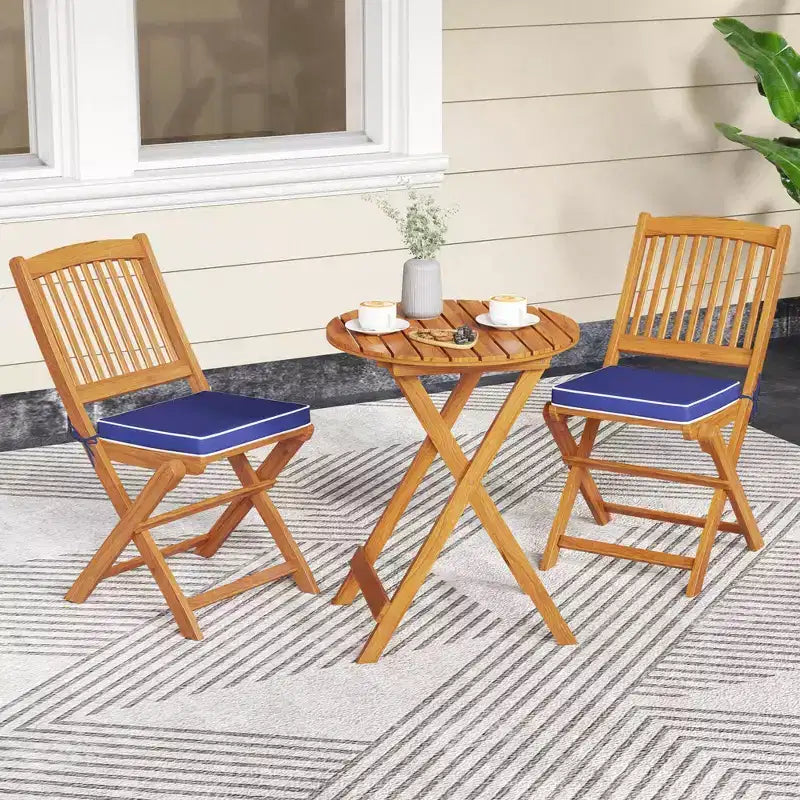 Set di 4 sedie pieghevoli da esterno Costway con schienale alto in legno di acacia e cuscini di seduta beige/blu navy/rosso