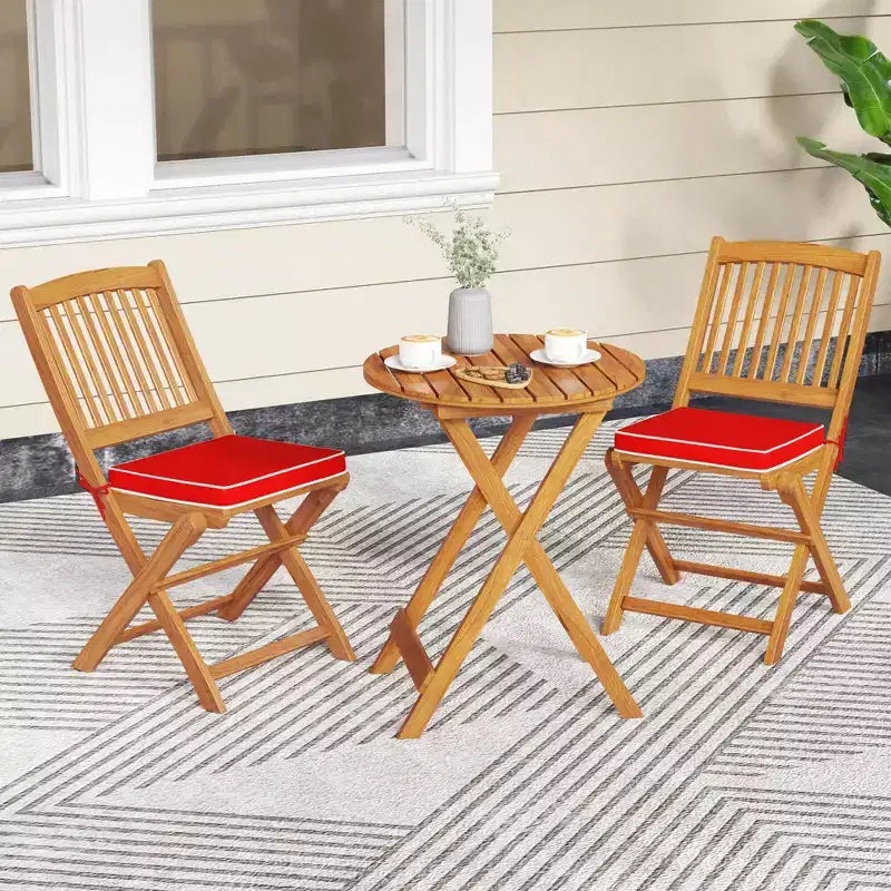 Set di 4 sedie pieghevoli da esterno Costway con schienale alto in legno di acacia e cuscini di seduta beige/blu navy/rosso