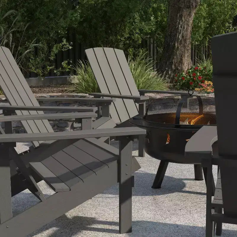 Merrick Lane Ayala 5 Piece Outdoor Leisure Set with Set of 4 Poly Resin Adirondack Chairs and Star and Moon Iron Fire Pit