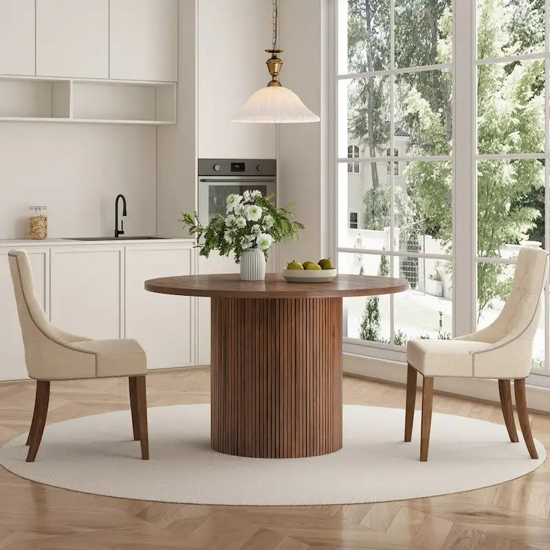 Tavolo da pranzo rotondo con piedistallo